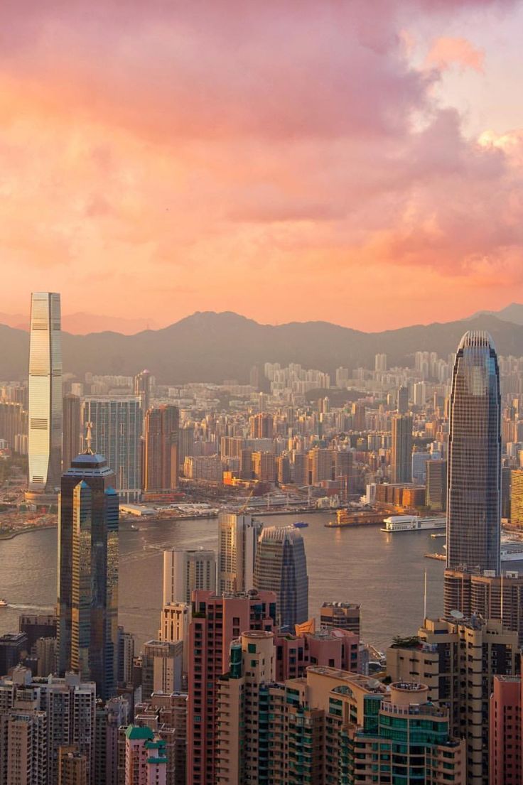 an aerial view of the city skyline at sunset