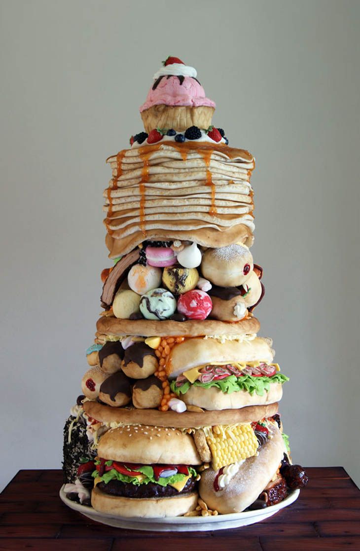 a large stack of food on top of a wooden table