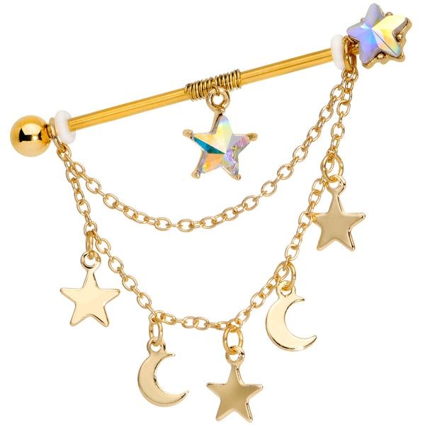 a gold plated barbell ring with stars and moon charms hanging from it's side