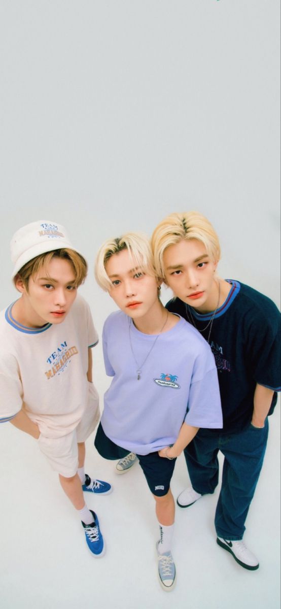 three young men standing next to each other in front of a white background with the words,