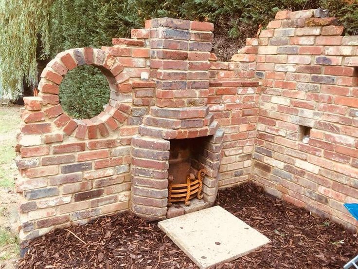 a brick oven with a fire place in it