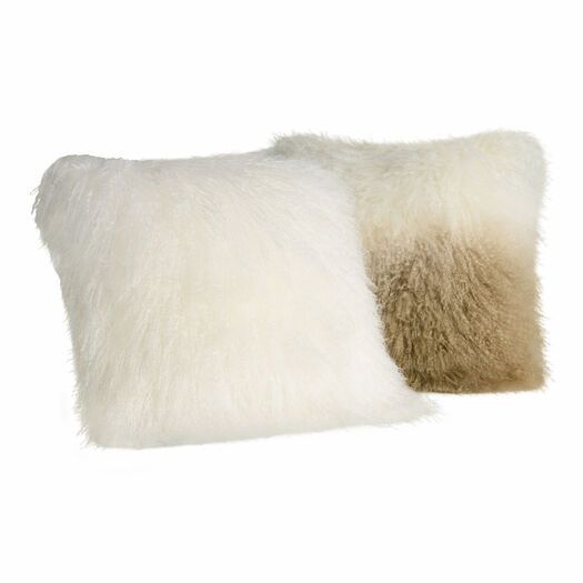 two white and brown fur pillows on a white background, one is made out of sheep's wool