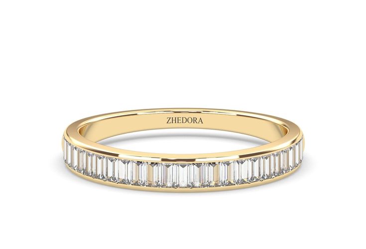 a yellow gold wedding band with baguettes in the middle and side stones on top