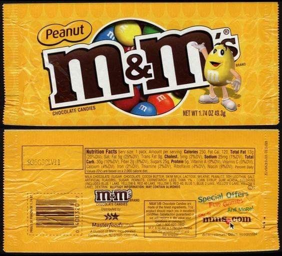 a close up of a candy bar with m & m on it