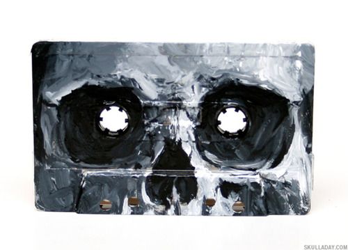 a black and white painting of a skull with two holes in it's face