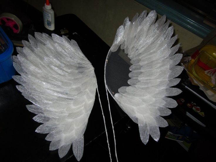 two white wings sitting on top of a table