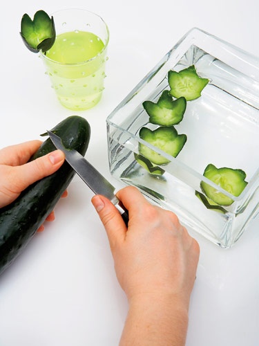 someone cutting cucumbers into small pieces with a knife