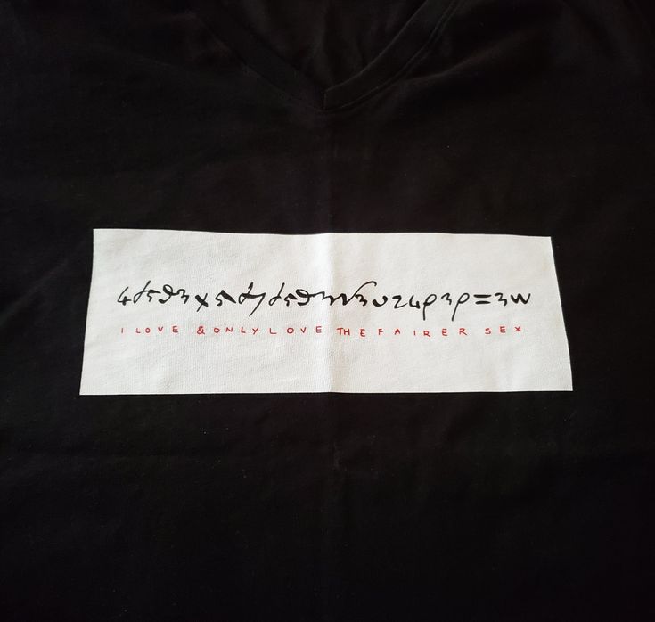 a black t - shirt with writing on it