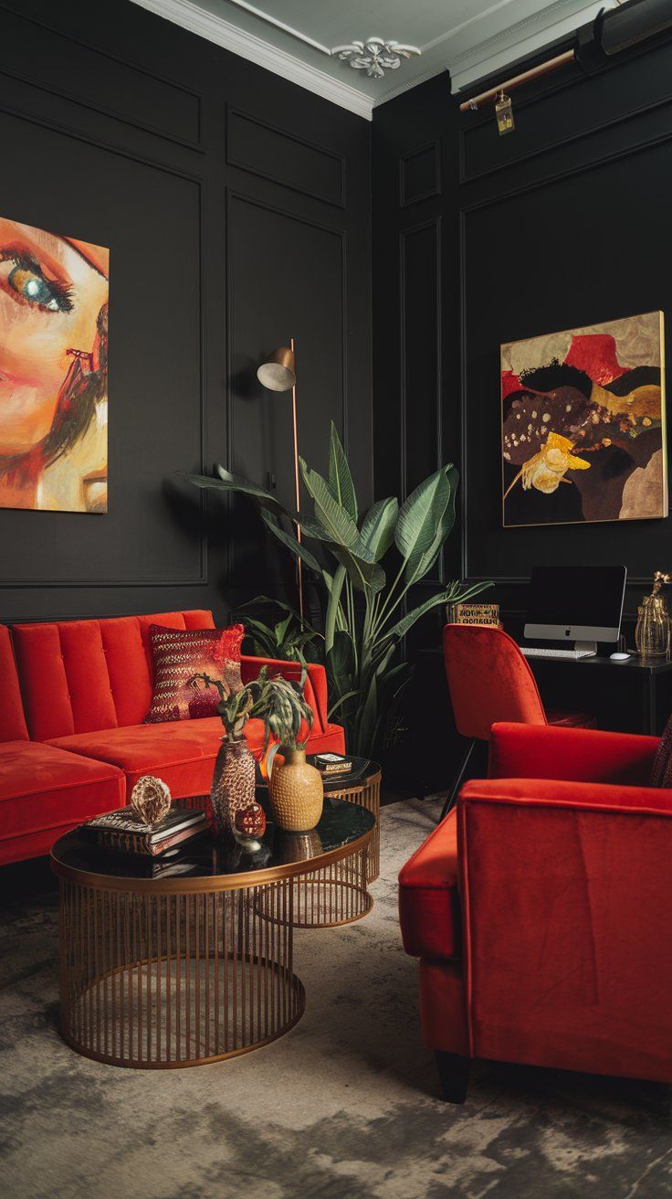 a living room filled with red couches and art work on the wall behind them