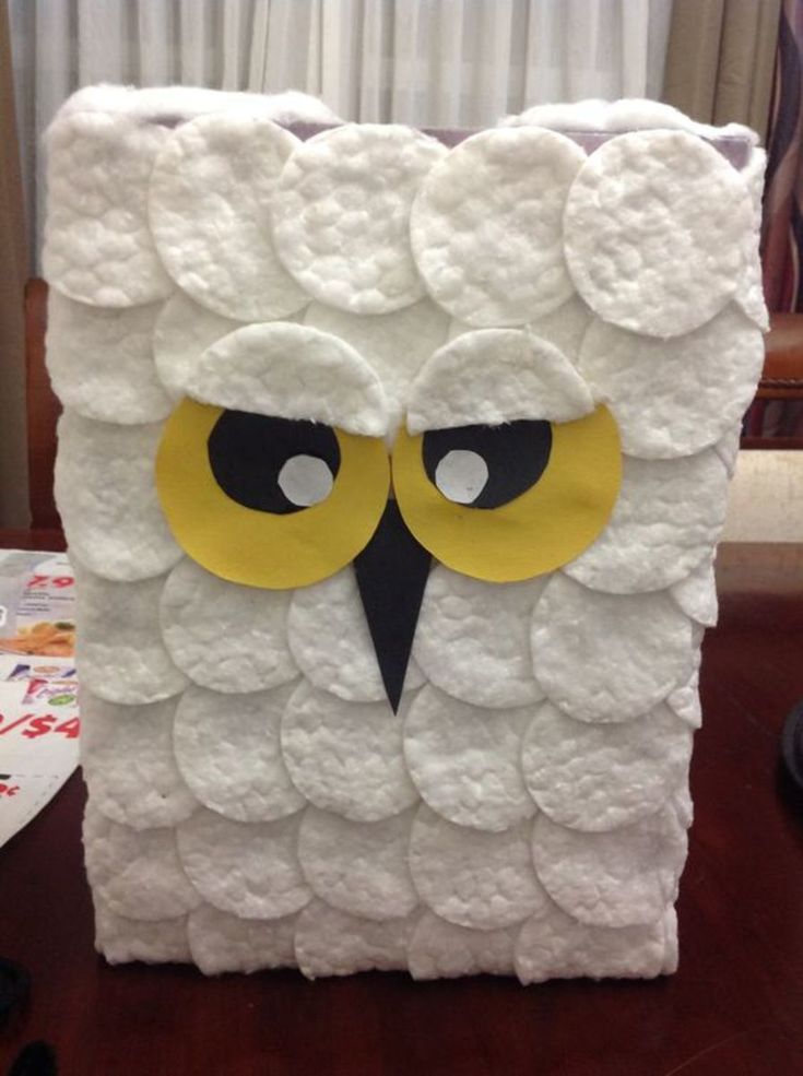 an owl made out of toilet paper sitting on top of a table