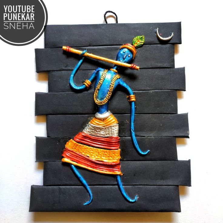 an art piece made out of black paper and painted with blue, orange and yellow colors