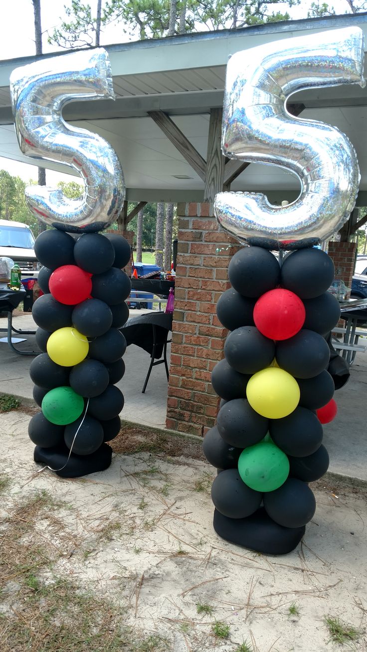 two large balloons that are shaped like numbers