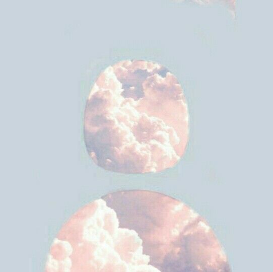 the sky is filled with clouds and there are two circles in front of each other