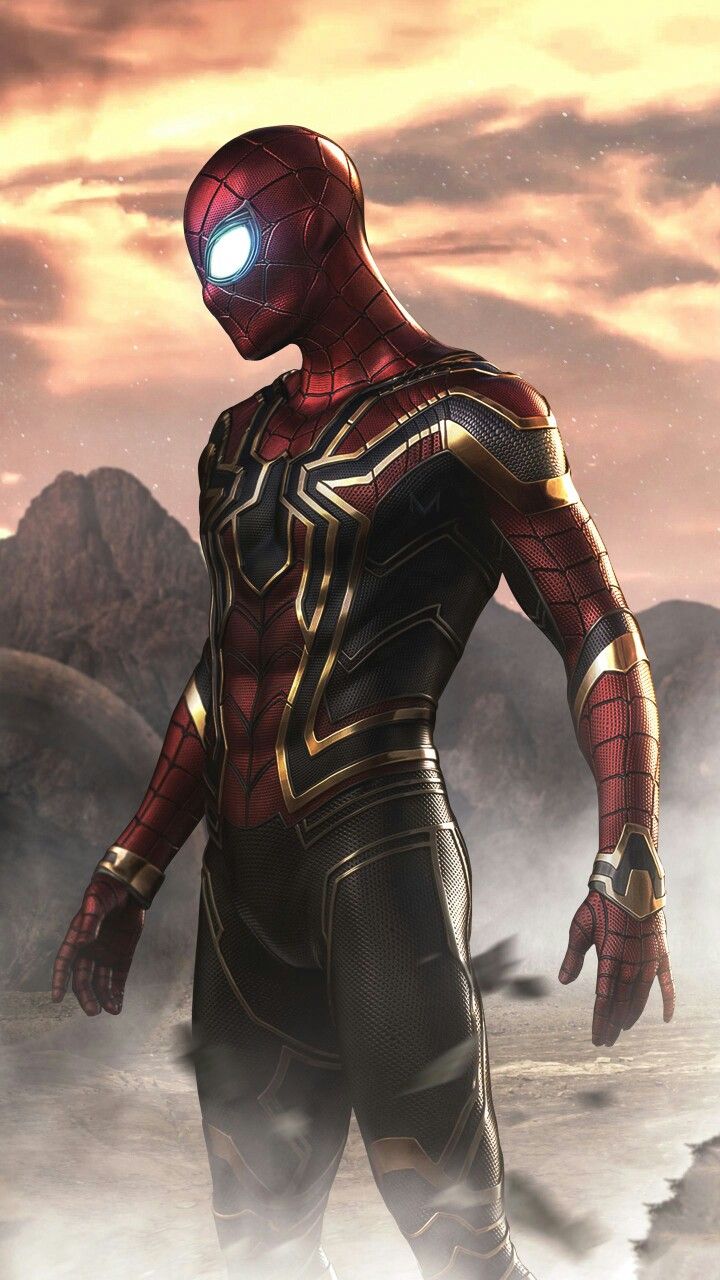 a man dressed as spider - man standing in the desert