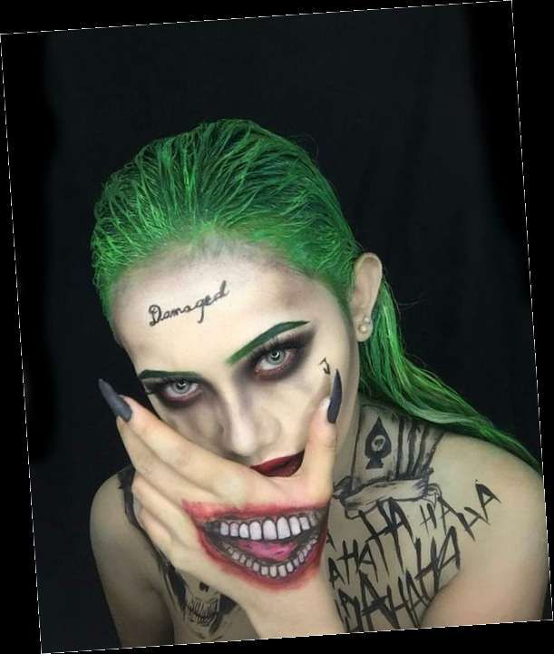 a woman with green hair and makeup