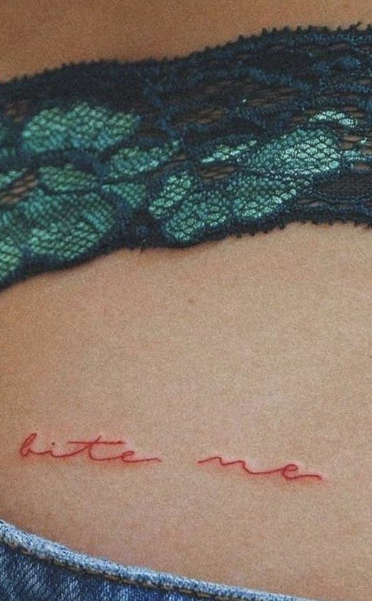 a woman's stomach with writing on it