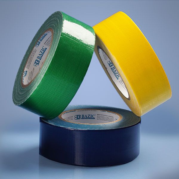 two rolls of green and yellow duct tape sitting on top of each other next to each other