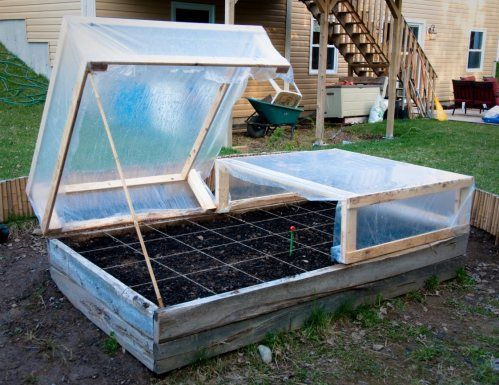 an open greenhouse with plants growing in it