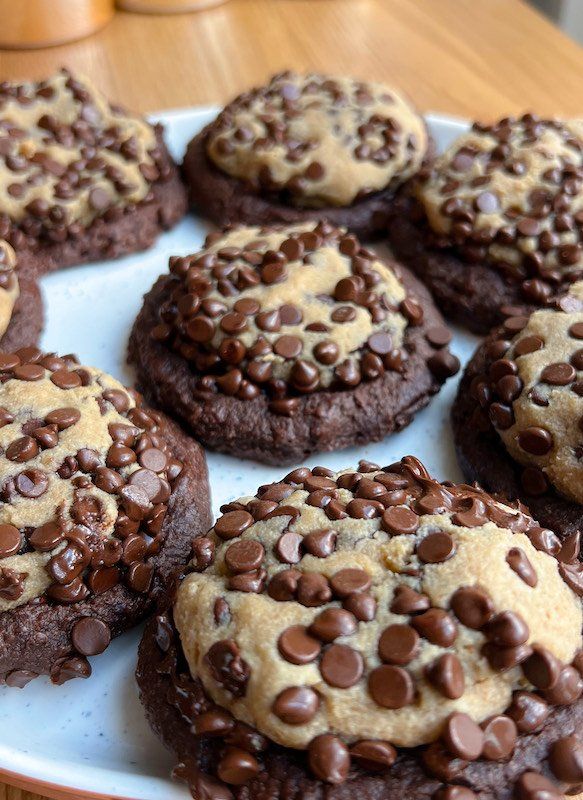 chocolate chip cookies are arranged on a white plate