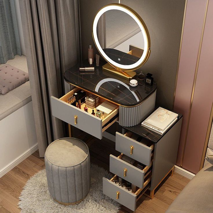 a vanity with drawers and a round mirror