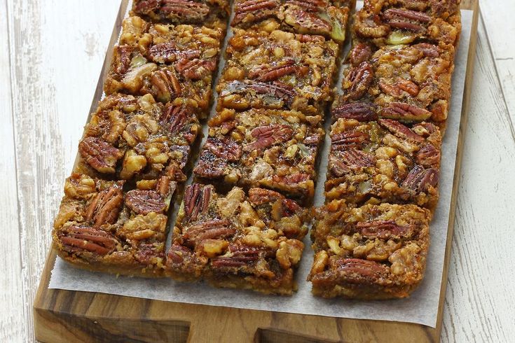 several pieces of pecan bread on a cutting board