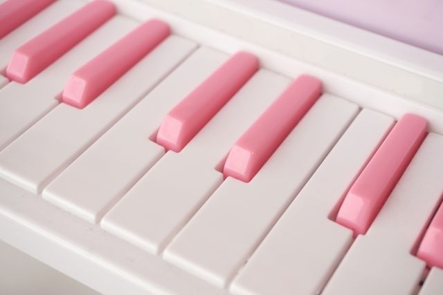 a close up of a pink piano keyboard