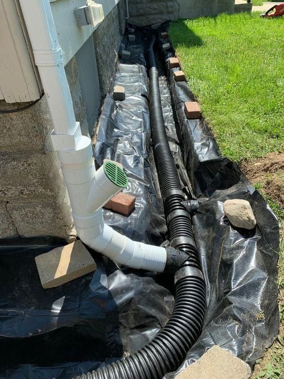 an image of a drain system installed in the ground for water supply and drainage systems