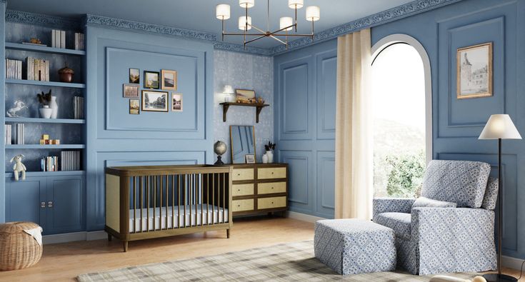 a baby's room with blue walls and furniture