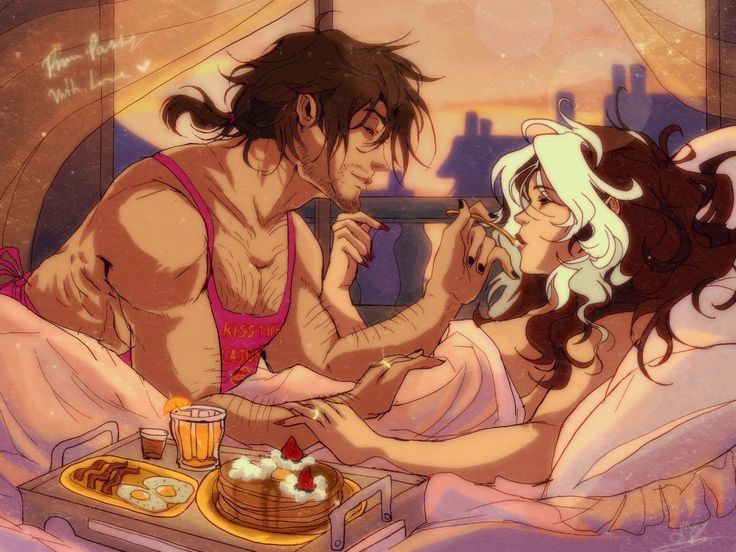 a man and woman in bed eating food