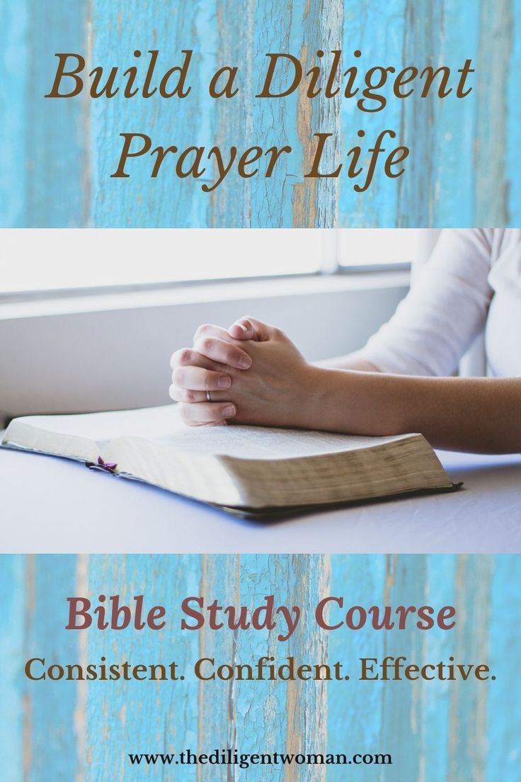 a woman sitting at a table with her hands folded over a book and the words, build a dilgentt prayer life