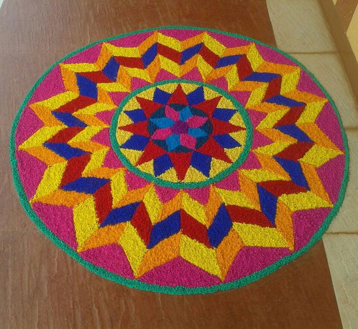 a multicolored circular rug on the floor