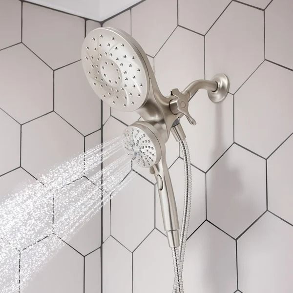 a shower head with water coming out of it