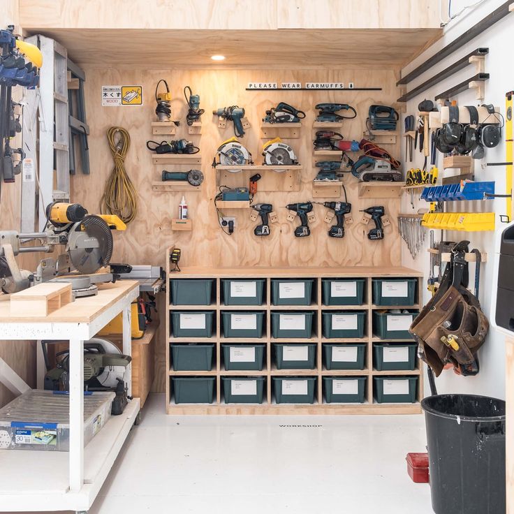 a workbench filled with lots of tools and supplies in a storage area next to bins