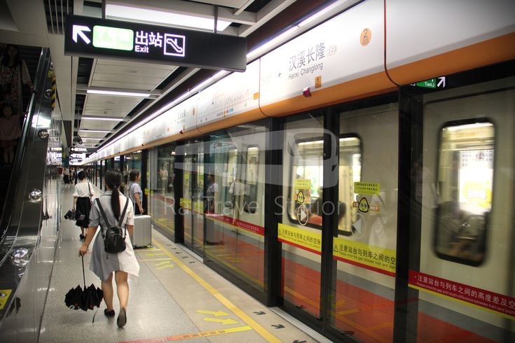 people are walking on the subway platform