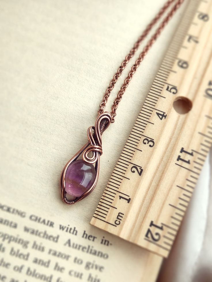 This is a cute and tiny pendant with a natural lavender amethyst stone. Simple and easy to wear, it is a timeless and sweet pendant. The metal part is solid copper that has been oxidized for an antique look. • Pendant size : H 3 x W 1.2 cm 🎁 This pendant comes with a free 18" copper chain necklace. Ready to wear or give as a gift. ✨ One-of-a-kind item ✨ There is only one of these. You will get the exact pendant as seen in the photos. CARE INSTRUCTION • Wire-wrapped jewellery is delicate, please Mini Wire Wrapped Pendant, Wire Wrapped Donut Pendant, Wire Wrapped Jewelry Tutorials Easy, Wire Necklace Ideas, Diy Wire Pendant, Wire Pendant Diy, Easy Wire Wrapping Stones, Wire Wrapped Bead Pendant, Wire Wrapped Pendant Tutorial