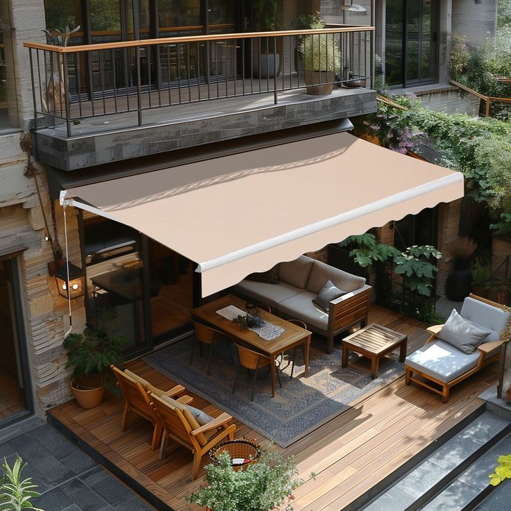 an outdoor living area with patio furniture and awning