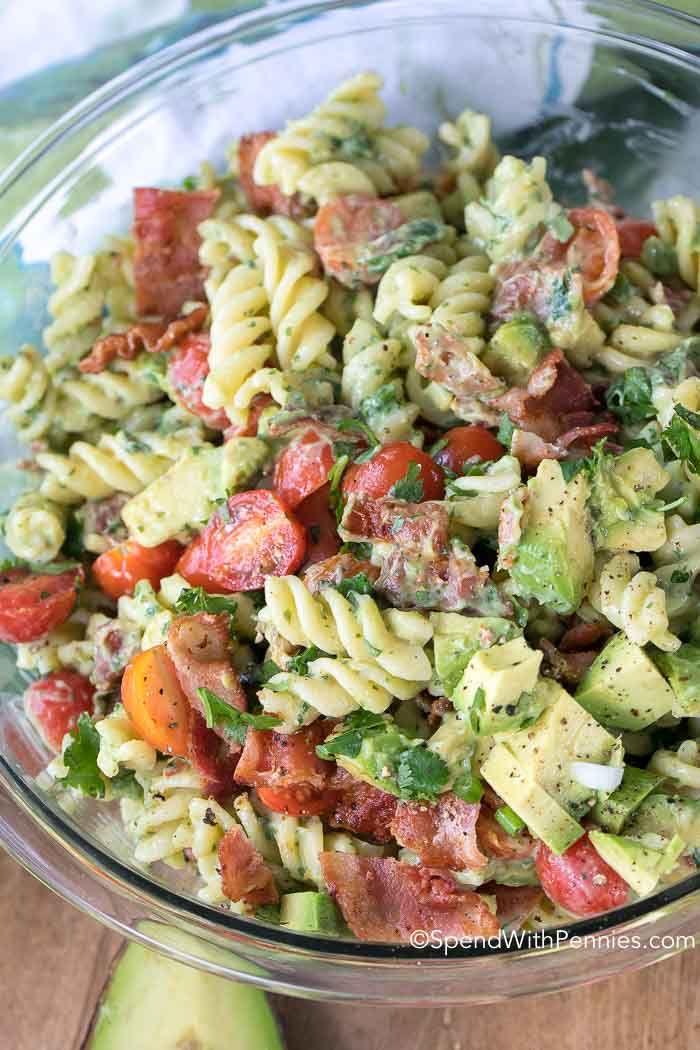 this pasta salad is made with avocado, tomatoes, and other fresh ingredients