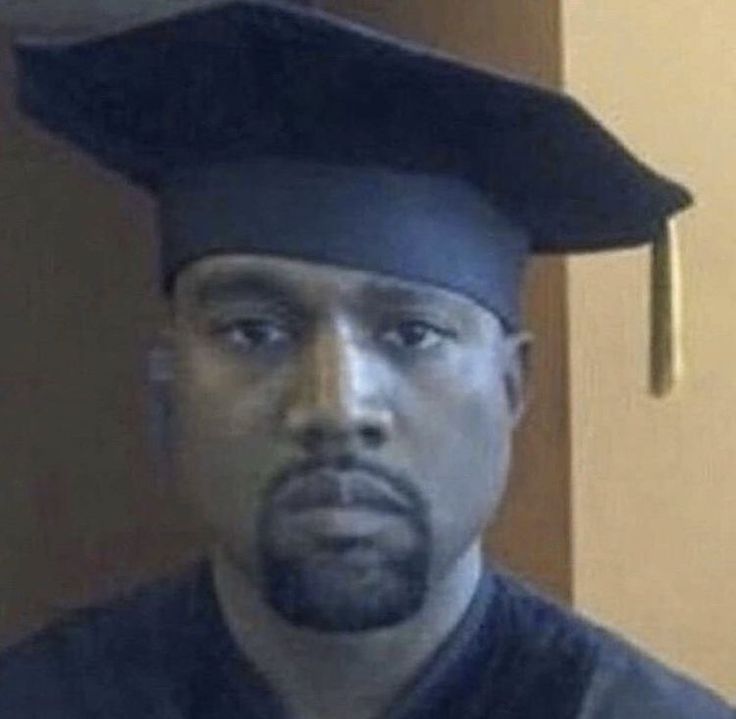 a man wearing a graduation cap and gown is looking at the camera with an intense look on his face