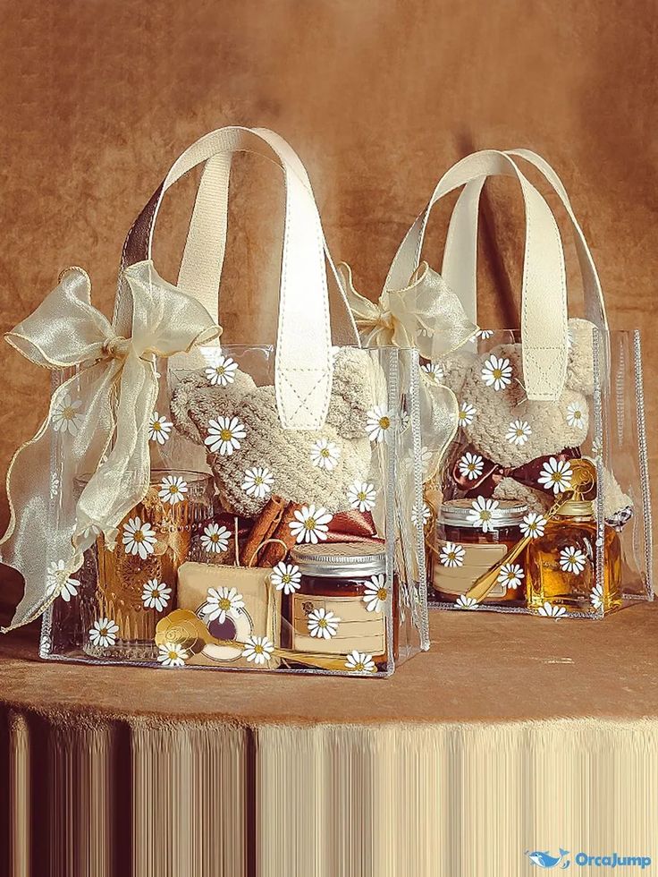 two clear bags filled with cookies and jams sitting on top of a wooden table