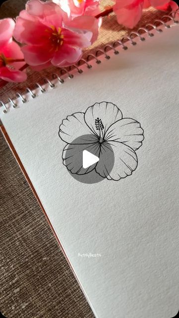 a notebook with an image of a flower on it