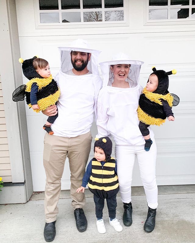 a family dressed up in bee costumes for halloween