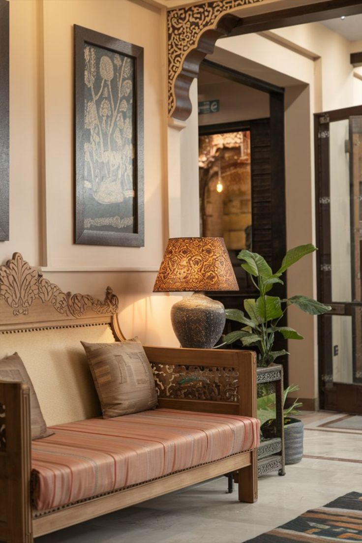 a living room filled with furniture and a lamp next to a plant in a vase