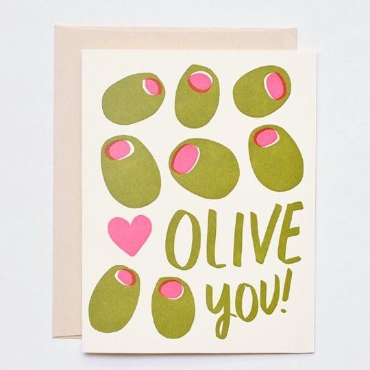 an olive card with pink hearts on it