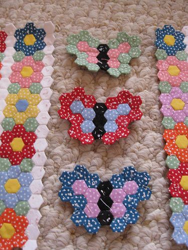 three pieces of fabric with flowers and polka dots on them are laying on the floor