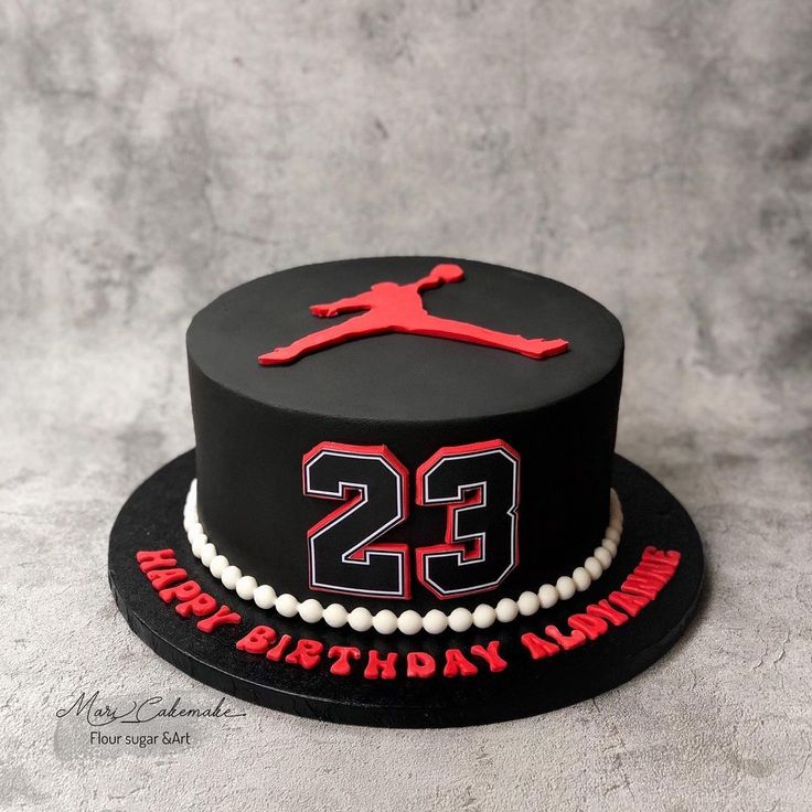 a black and red birthday cake with the number twenty two