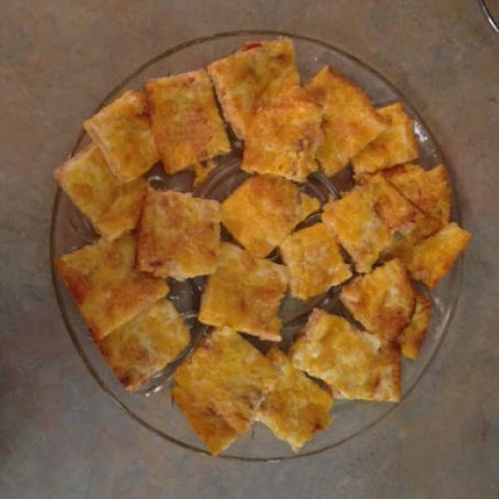 there are many pieces of food on the glass plate and one is cut into cubes