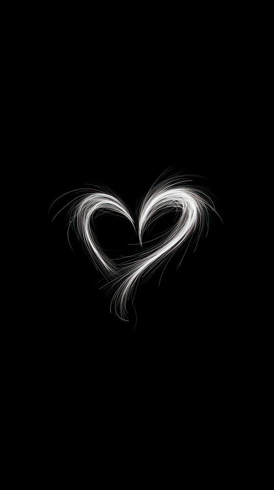 the shape of a heart is shown on a black background with light streaks in it