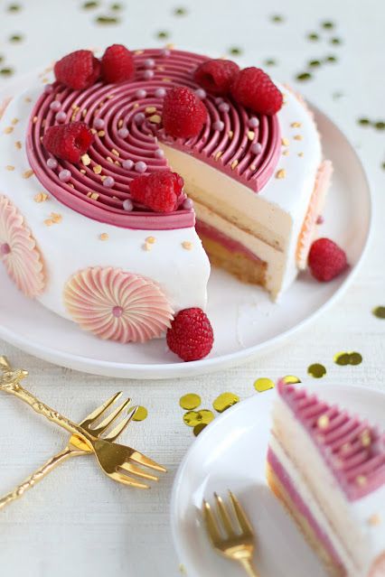 a slice of cake with raspberries on top