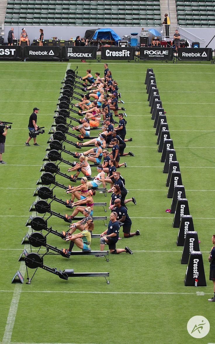 a group of people doing exercises on the field