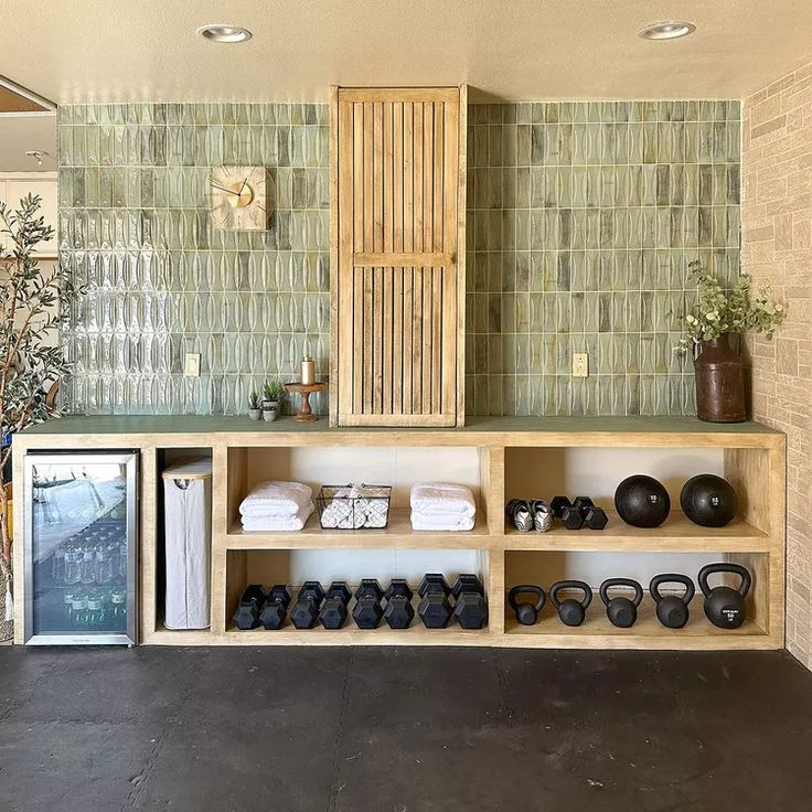 there are many pairs of shoes on the shelf next to each other in this room